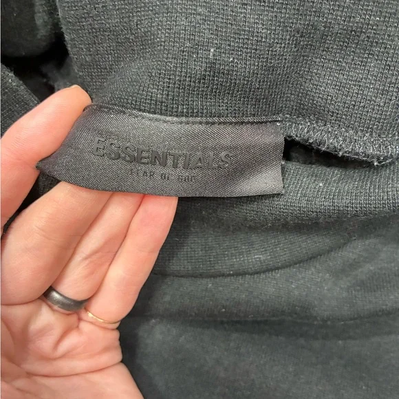 This is a Fear of God Essentials black sweatshirt. - Picture 5 of 7